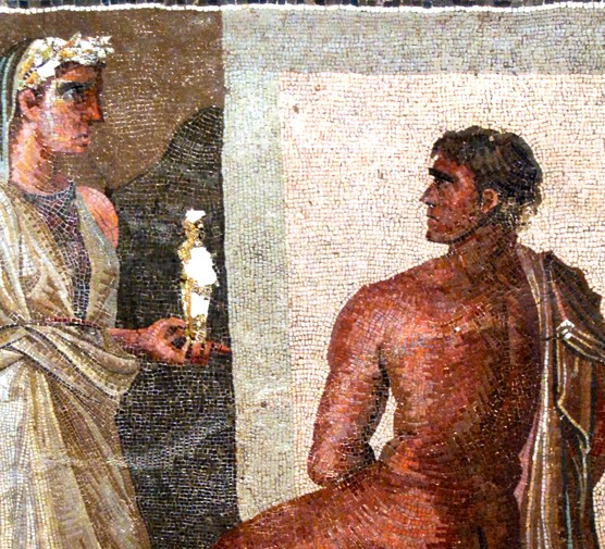 This Roman mosaic depicts Orestes and Iphigenia, with Iphigenia holding a small statue of Artemis — imagery drawn from Greek myth and popular across the Roman world. Mosaics like this often decorated the floors of bath complexes and latrines, where vibrant storytelling scenes enlivened communal spaces.
