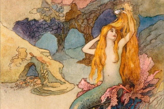A mermaid combing her hair