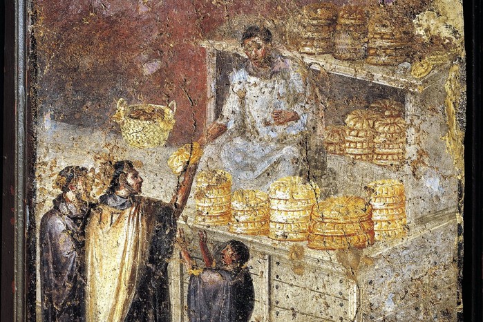 This 1st-century AD Roman fresco shows loaves being distributed to members of the community, reflecting the importance of public grain and bread handouts in daily life.