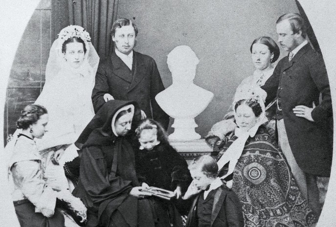 Victoria pictured with her children and a bust of Prince Albert, 1863. Beatrice was the last of her babies officially recorded – but did the queen later give birth to another daughter, fathered by John Brown? (Image by Getty Images)