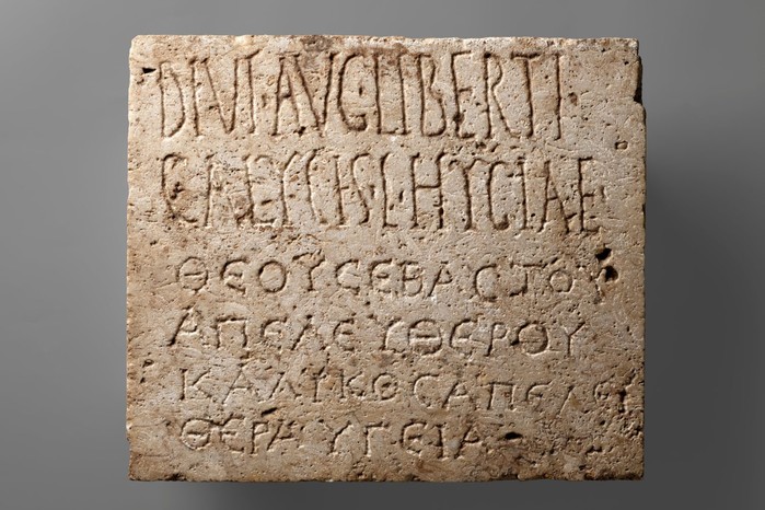 A bilingual funerary inscription in Latin and Greek – one of countless texts from the ancient Roman world that AI can search and compare (Image by Getty Images) A large stone with letters carved into it