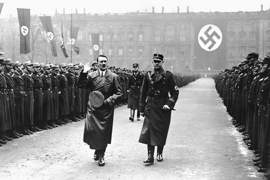 German Chancellor Adolf Hitler reviews storm troopers