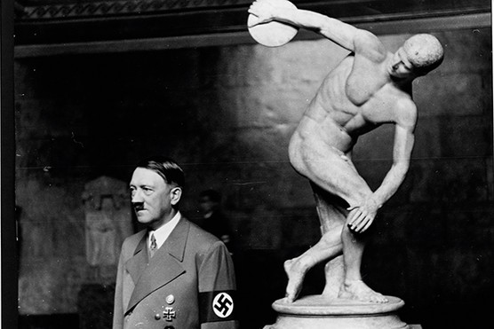 Adolf Hitler with a statue of Discobolos, the Discus Thrower. Modern far-right groups that cleave to classical imagery have taken their inspiration from the ideologies of the 20th century (Photo by Library of Congress/Corbis/VCG via Getty Images) Adolf Hitler stands with his back to a statue of Discobolos, the Discus Thrower