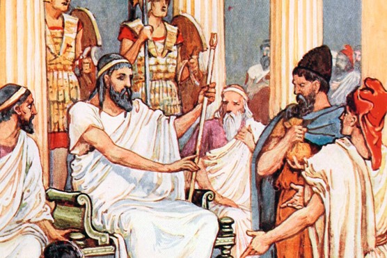 Solon was a statesman, lawmaker and poet, and is often credited with having laid the foundations for Athenian democracy. (Photo by: Universal History Archive/UIG via Getty images) Ancient Greek statesman Solon sits on a throne, with a subject petitioning him