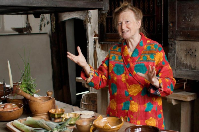 Historian Ruth Goodman speaking in the kitchen of Plas Mawr, a Tudor-era townhouse.