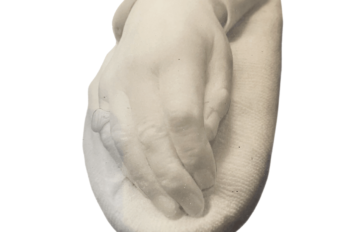 Screenshotwebready 2025-07-15 at 16.32.08 A white stone cast of a man's right hand. On the little finger, there is the a large signet ring